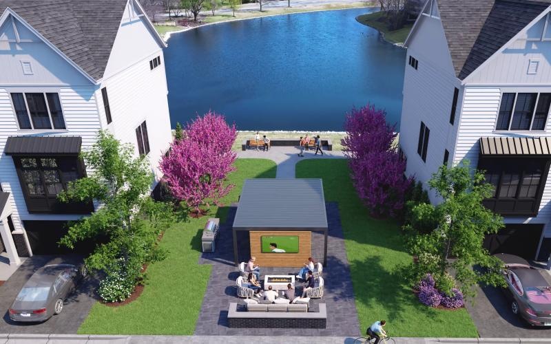 a group of people sitting at a table in a small courtyard